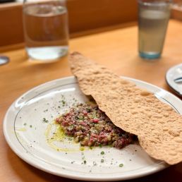Birdie's signature dishes Menu changes daily. Known for seasonal pastas, crudo, steak tartare, and vanilla soft serve.